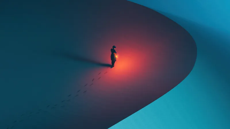 点灯在沙漠中行走的男子